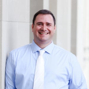 Team member headshot of male Digital Maelstrom COO smiling